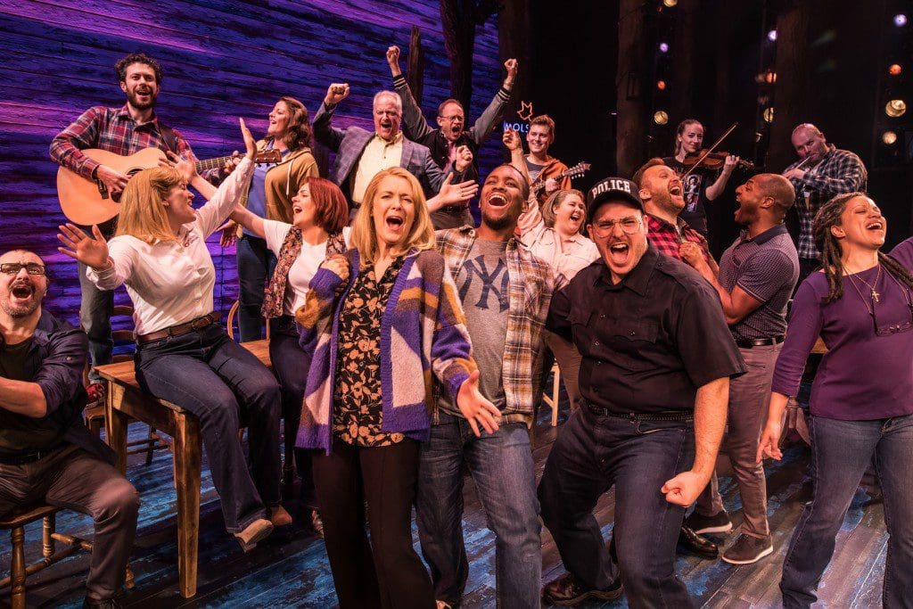 An action shot from the musical Come From Away